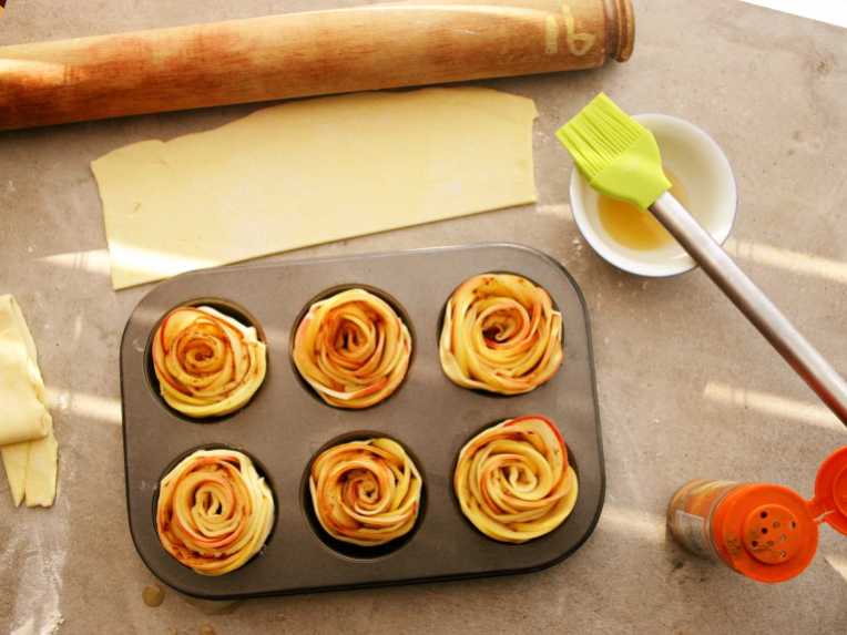 Apple roses in a muffin tin, ready for the oven