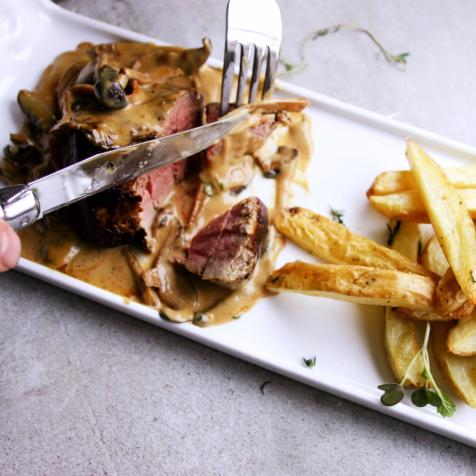 Mushroom sauce with beef fillet and fries