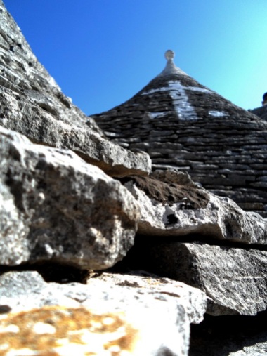 Trulli house roof adorned with a family crest
